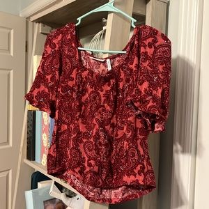 Women’s red paisley blouse. To chest to end of garment 13.5 inches. LUQ